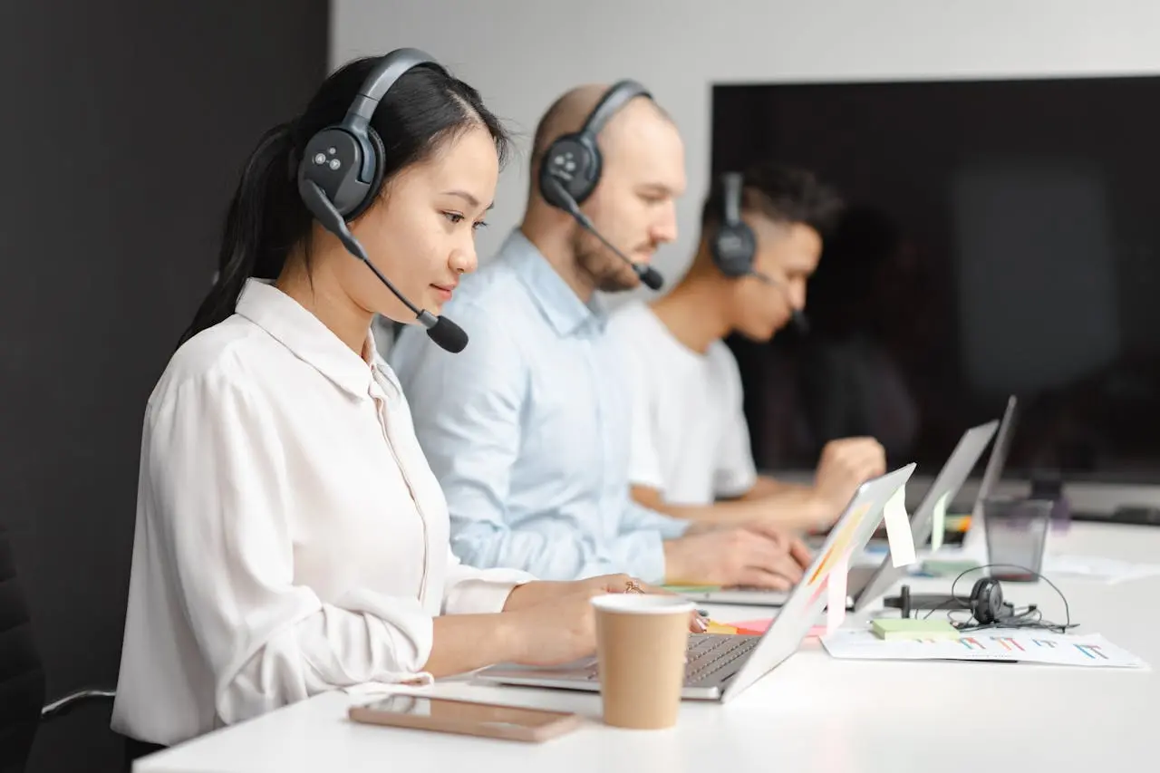 Customer service representatives at desks