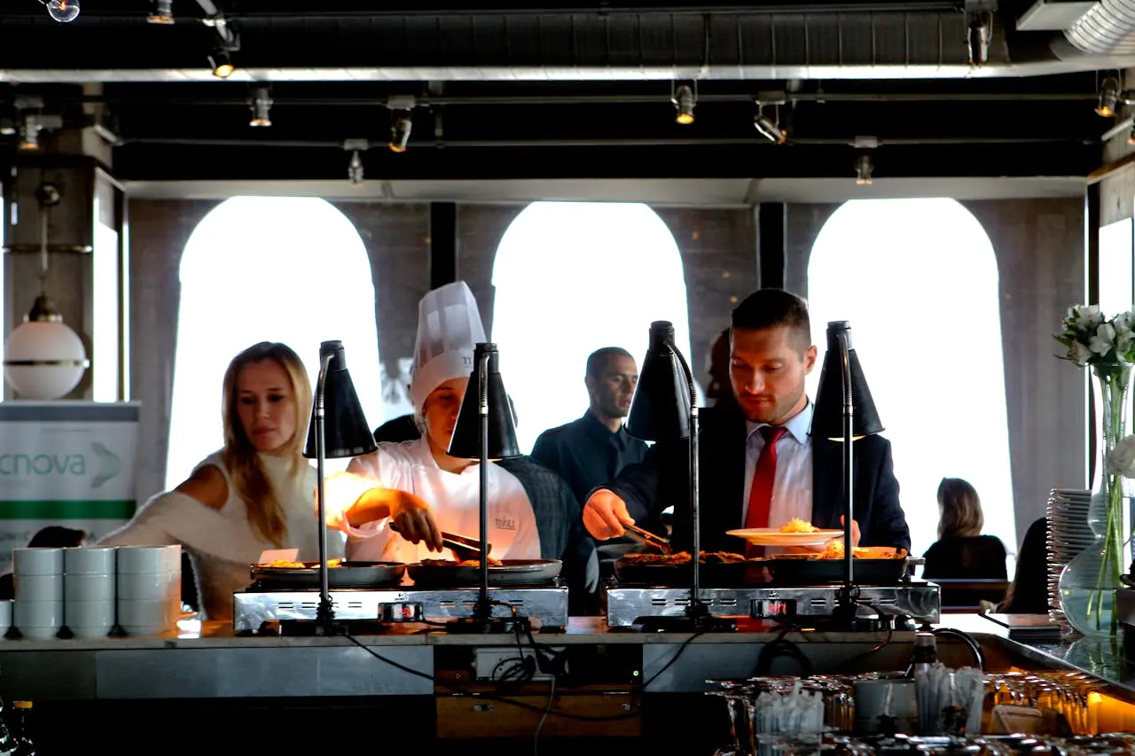 Restaurant staff at pass with food