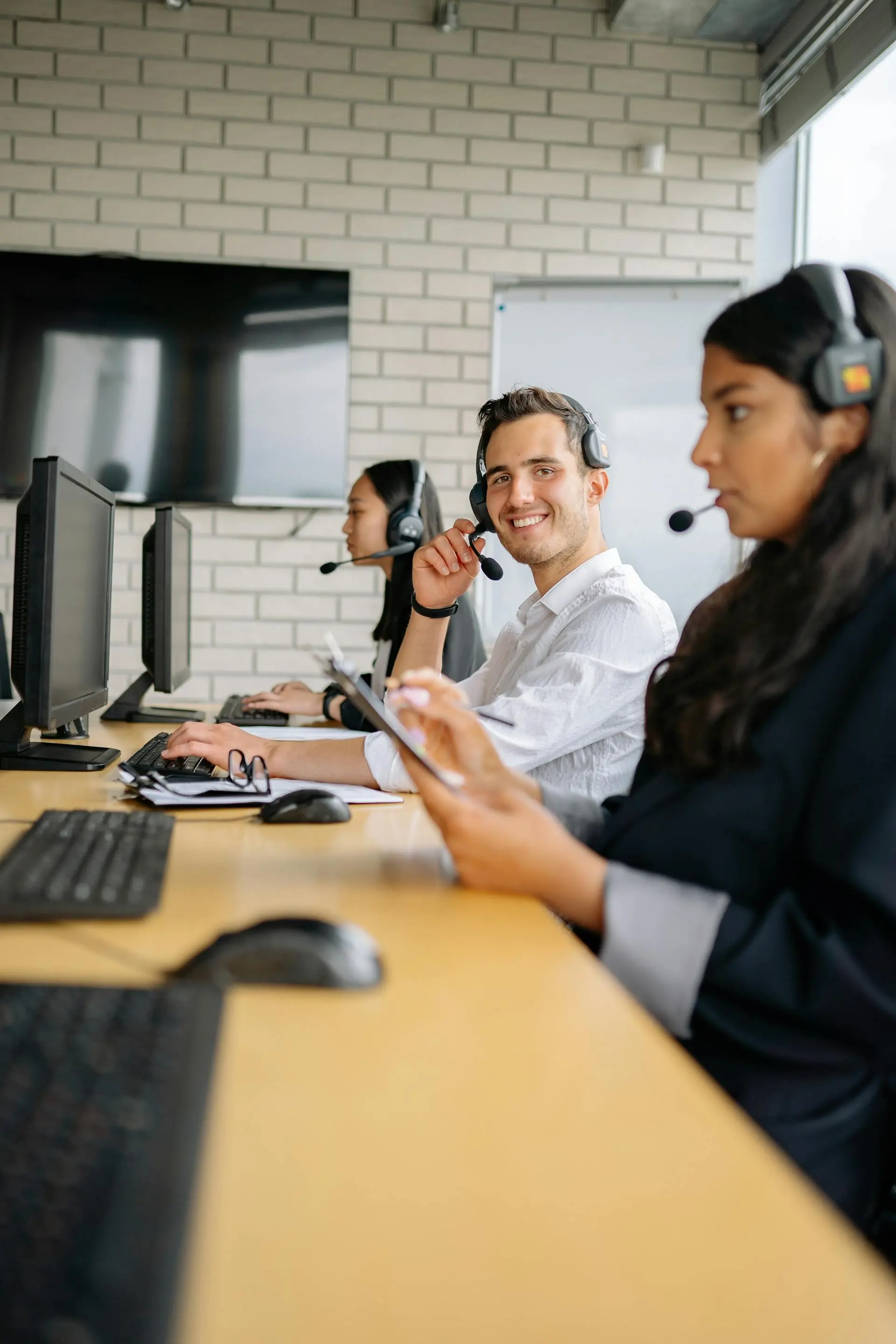 Sales and marketing team at desk in office