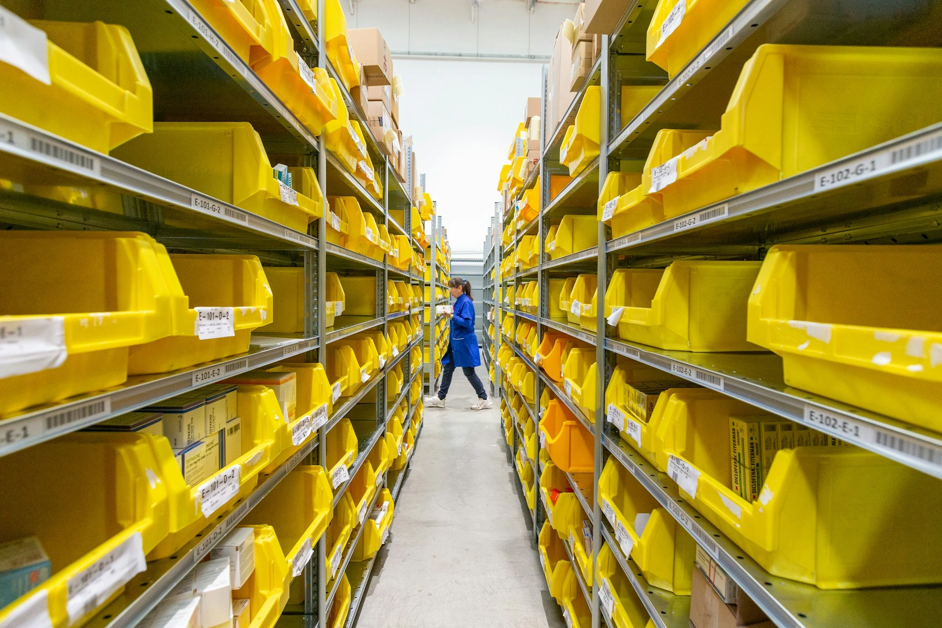 Woman in warehouse near shelves